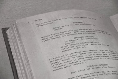 a close up of an open book with writing on it