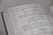 a close up of an open book with writing on it