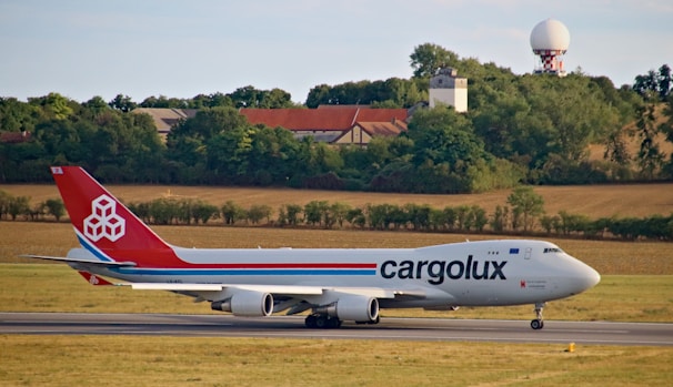 An airplane preparing for takeoff with cargo.