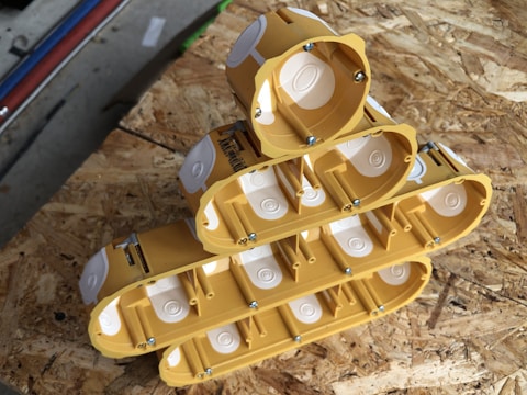 Stack of electrical devices and fixtures ready for installation on site