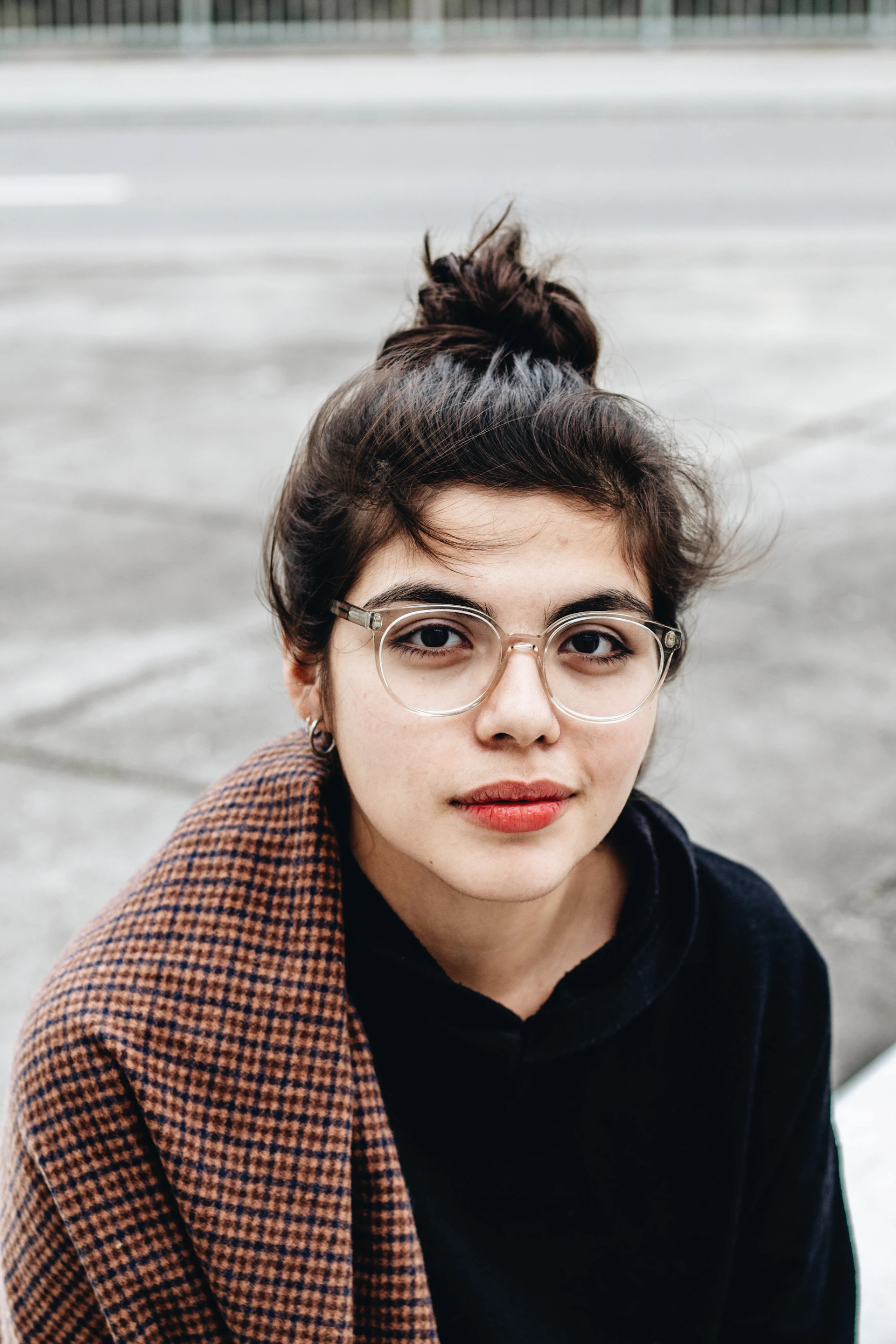 woman in black hoodie wearing eyeglasses