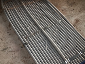 Rows of heavy-duty HR coils ready for shipment at KL Concast's manufacturing facility.