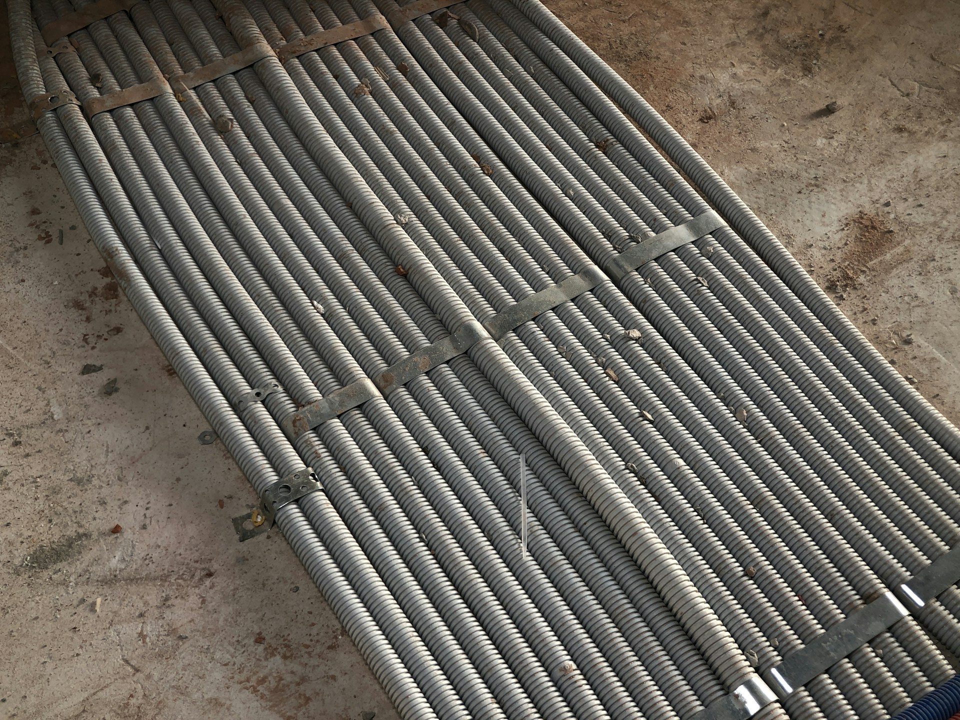 A sleek, modern steel rebar coil resting on a clean factory floor, bathed in soft natural light.