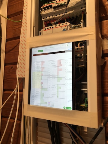 Technician installing smart home automation panel in modern residential setting