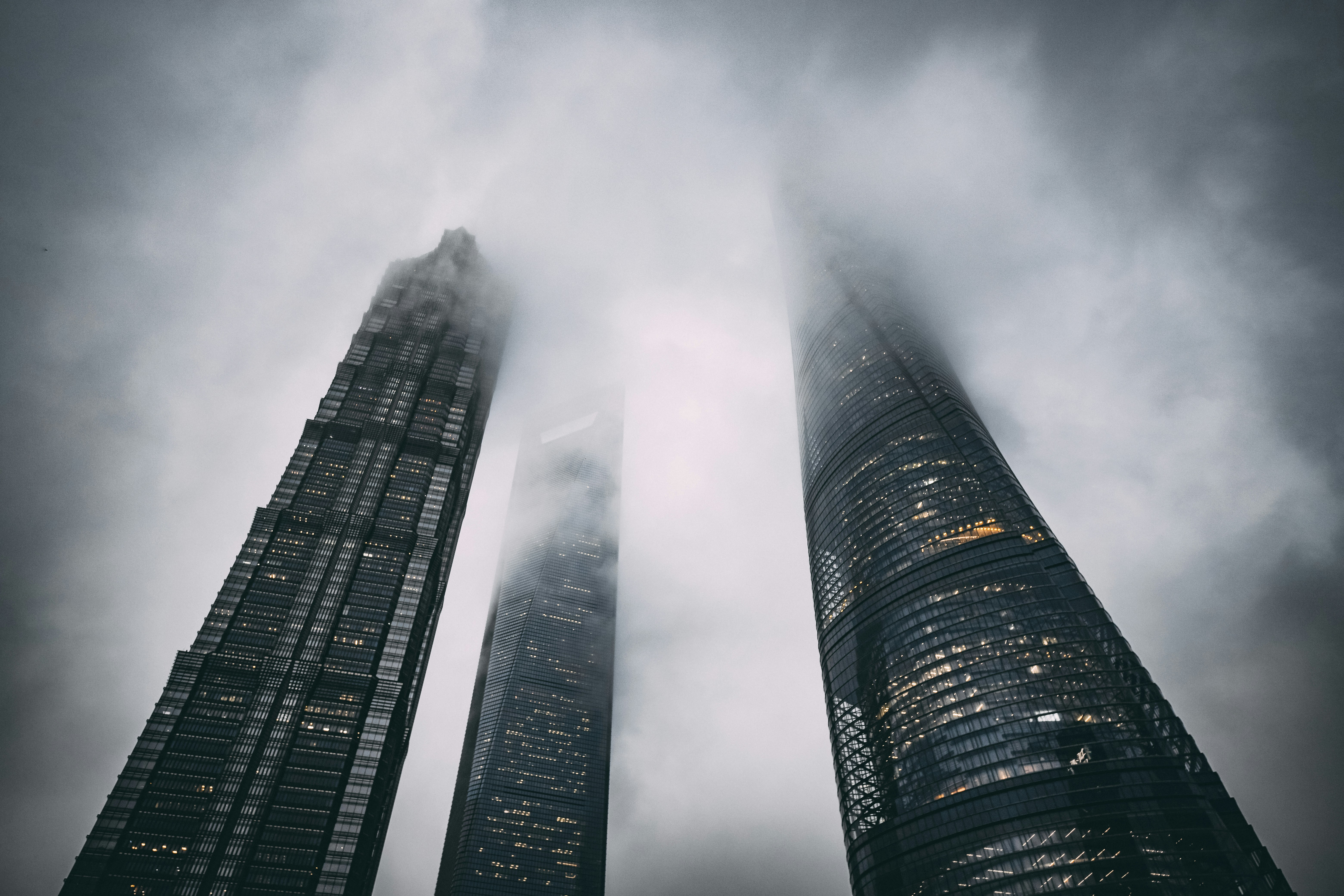 low-angle photography of concrete high-rise buildings