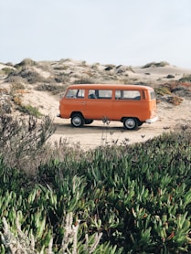 orange minivan on desert