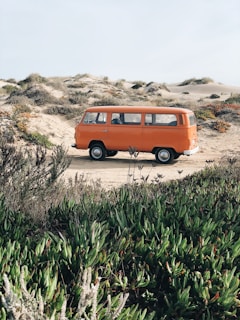 orange minivan on desert