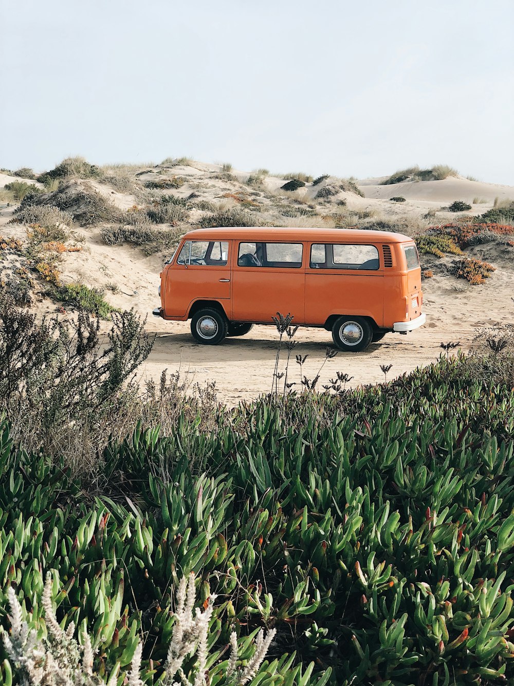 orange minivan on desert