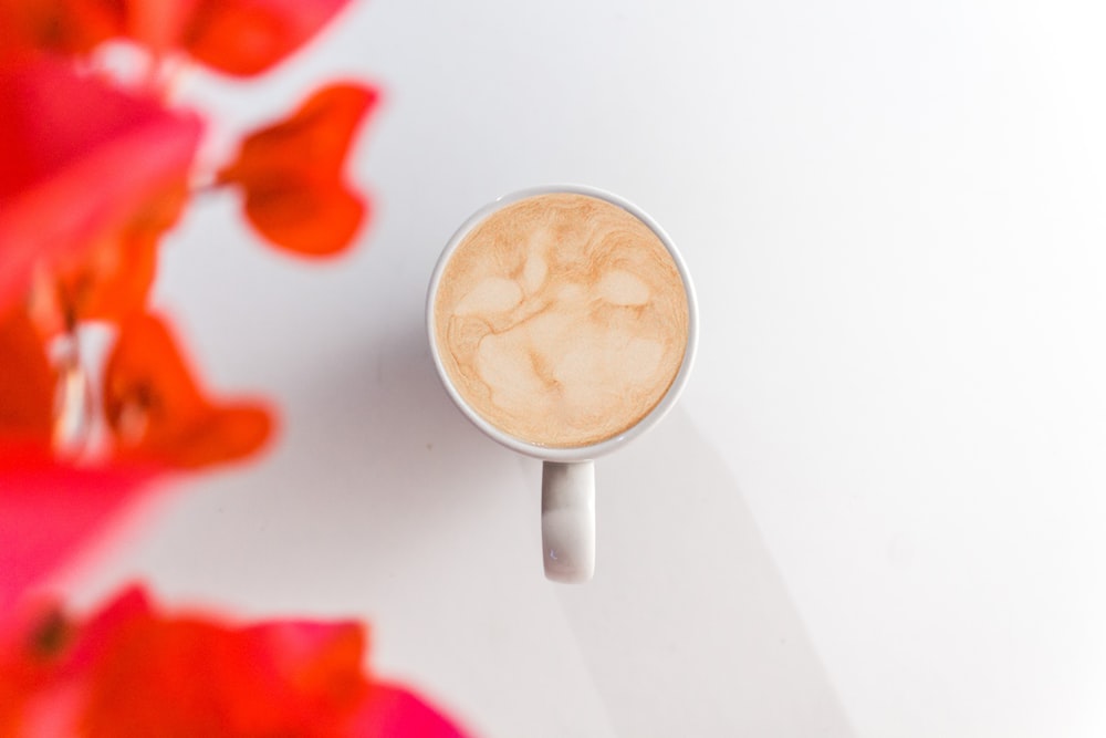 brown liquid in white ceramic mug