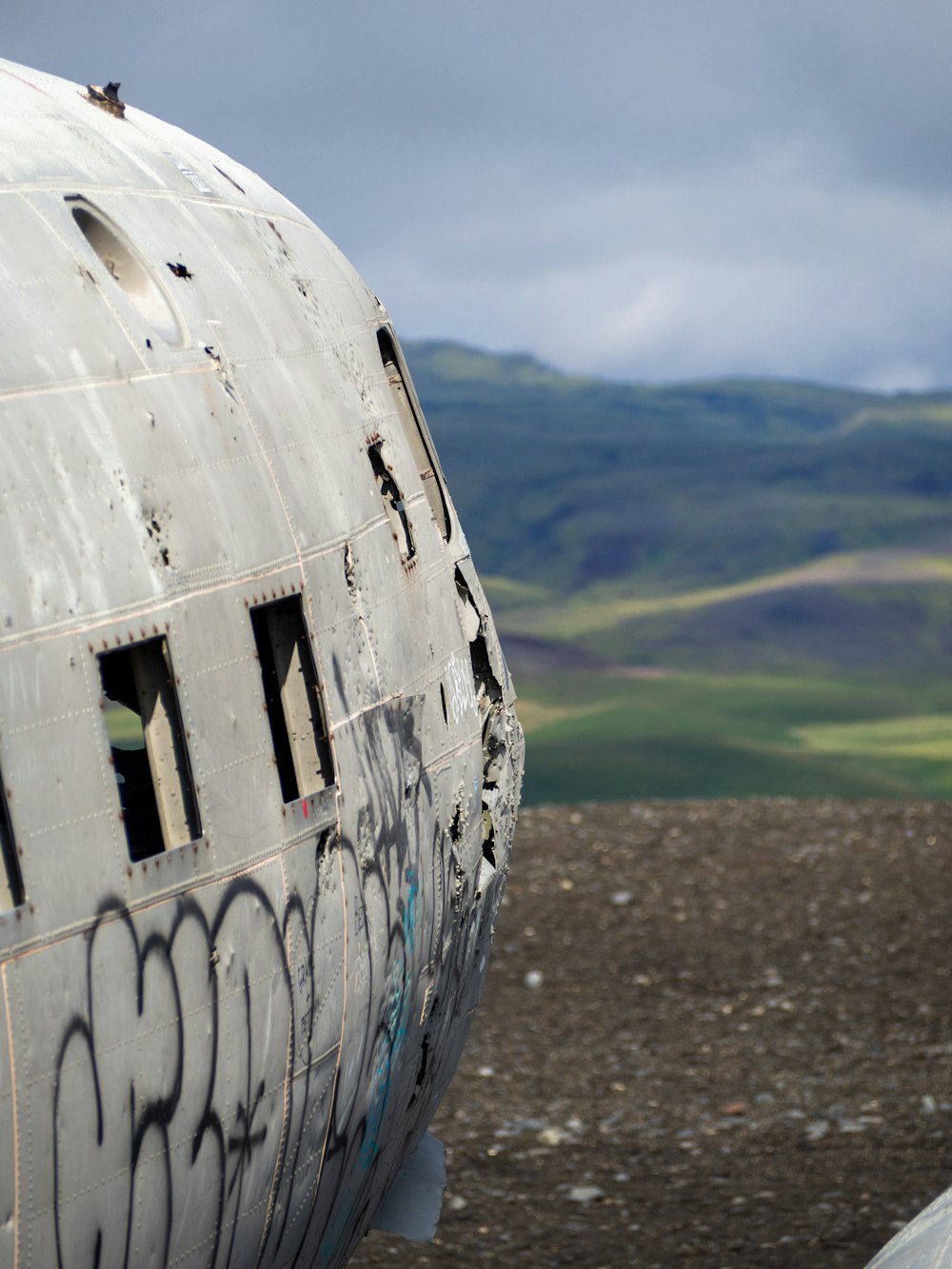 a large airplane with graffiti on the side of it