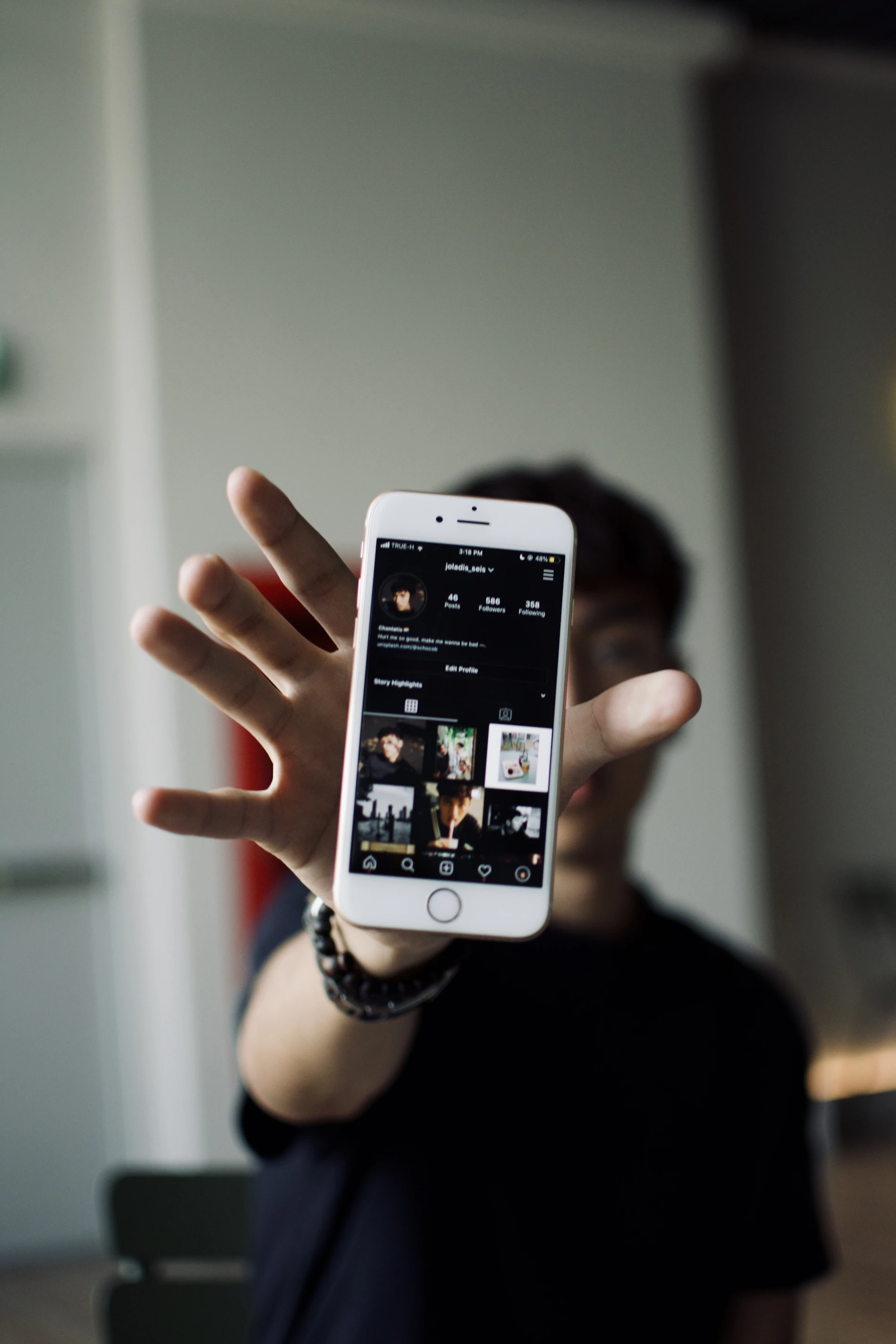 A hand holding a phone