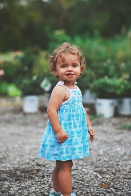 girl wearing blue and white dress