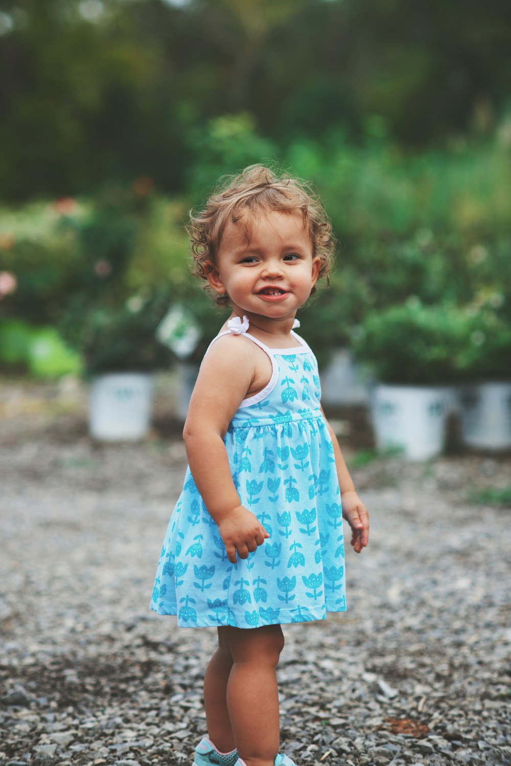 girl wearing blue and white dress