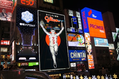 a city street filled with lots of neon signs