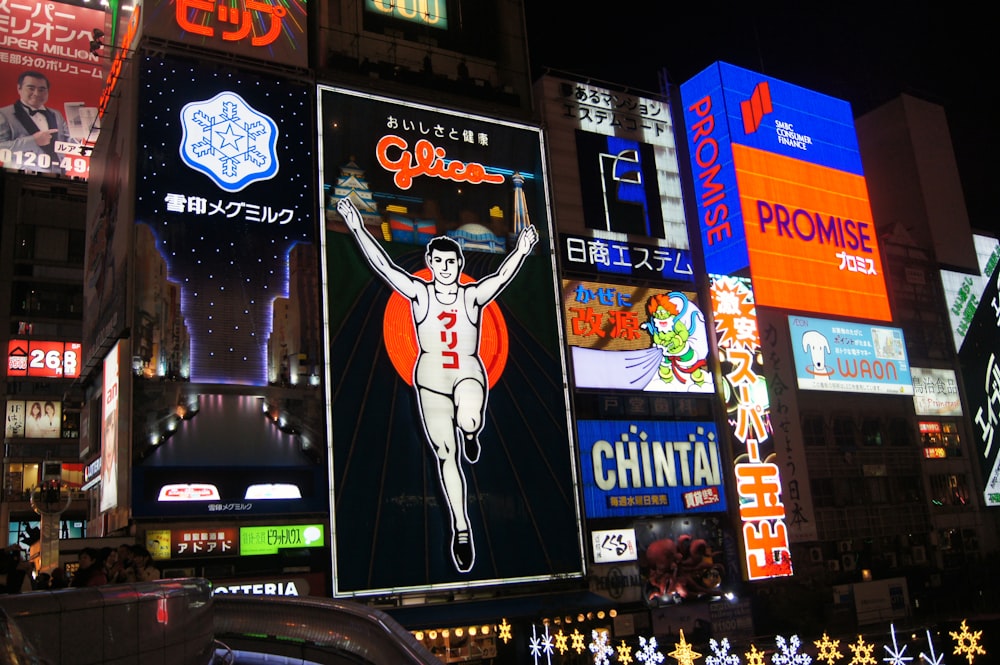 a city street filled with lots of neon signs