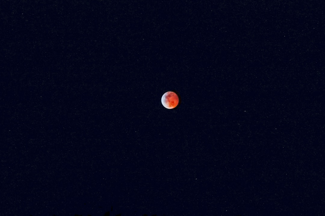 red full moon in black sky