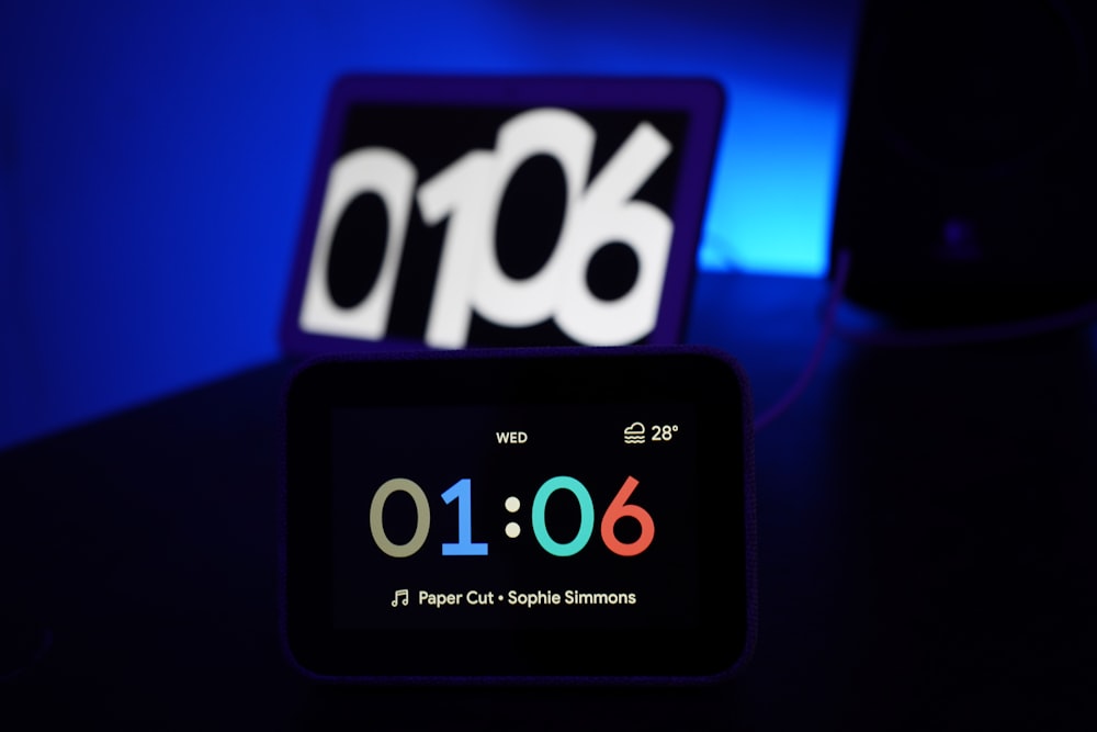 black digital clock at 1:06