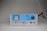 A clear, plastic-cased control unit with a blue and white interface, featuring a gauge meter on the left side, control dials, and labeled buttons. The brand 'just chlor' is prominently displayed on the front panel. The product is placed against a neutral background.