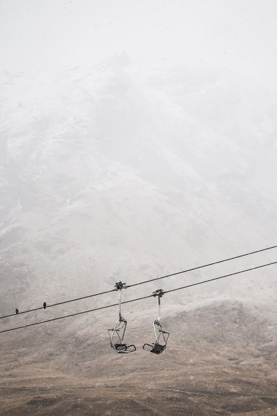 Ski lifts on a snow covered mountain