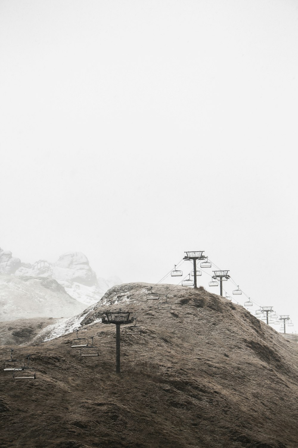 brown mountain under cloudy sky