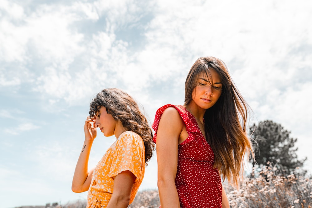 two woman on focus photography