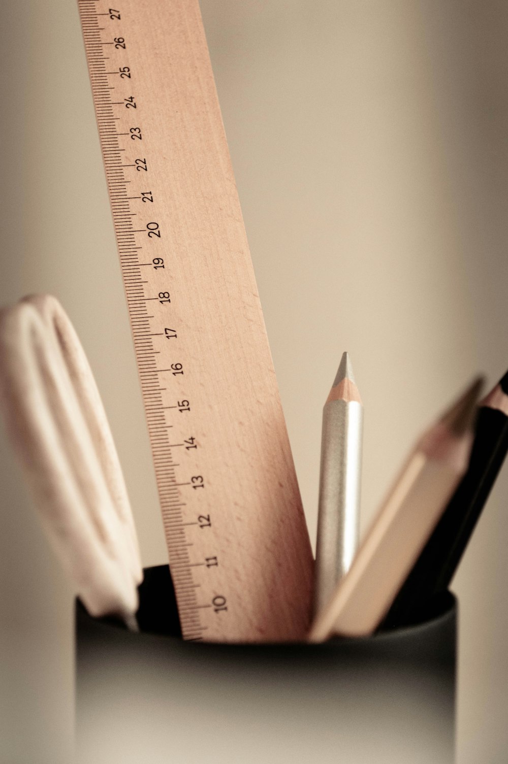 brown wooden ruler and pencil