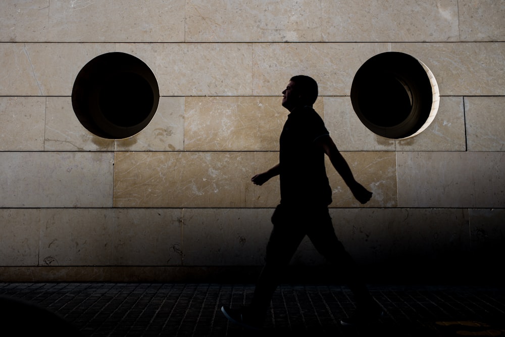 silhouette of man walking