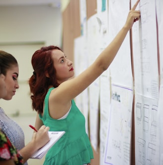 woman pointing at paper