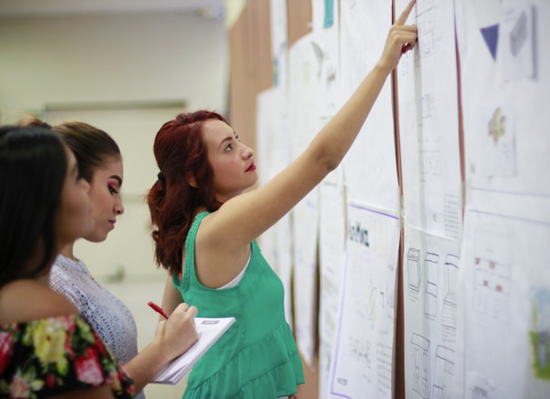 woman pointing at paper