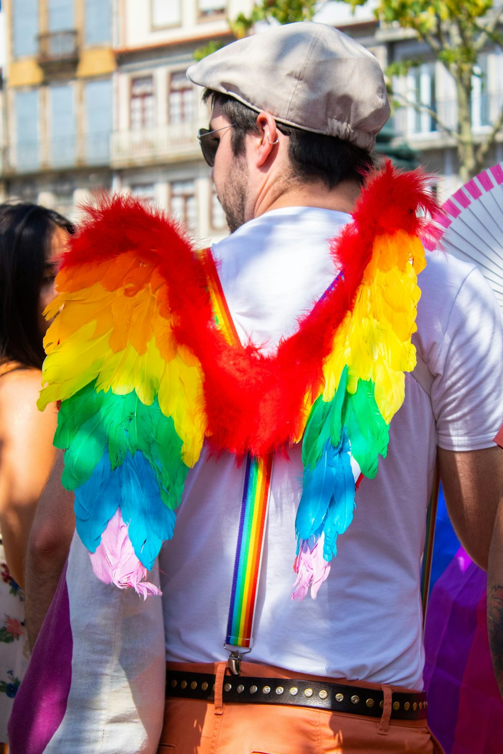 man in white shirt with wings at daytime