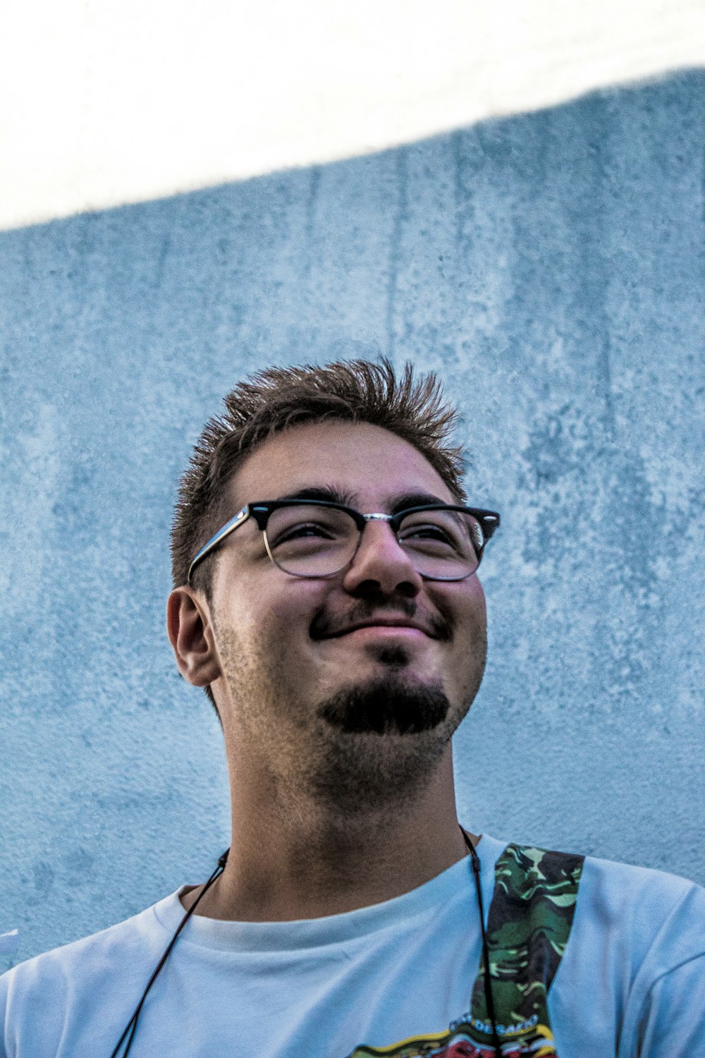 smiling man wearing black framed eyeglasses