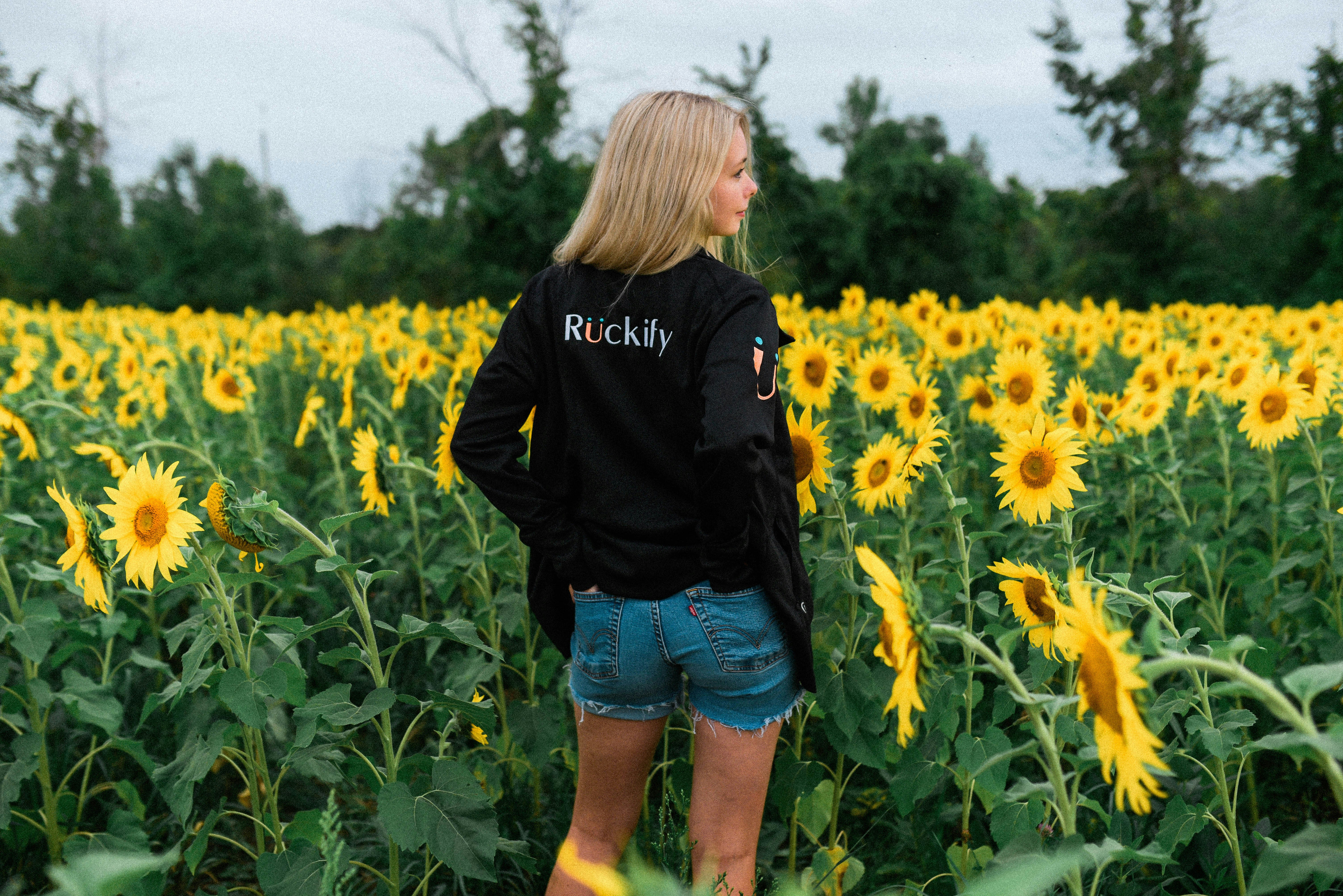 woman standing on Sunflower field