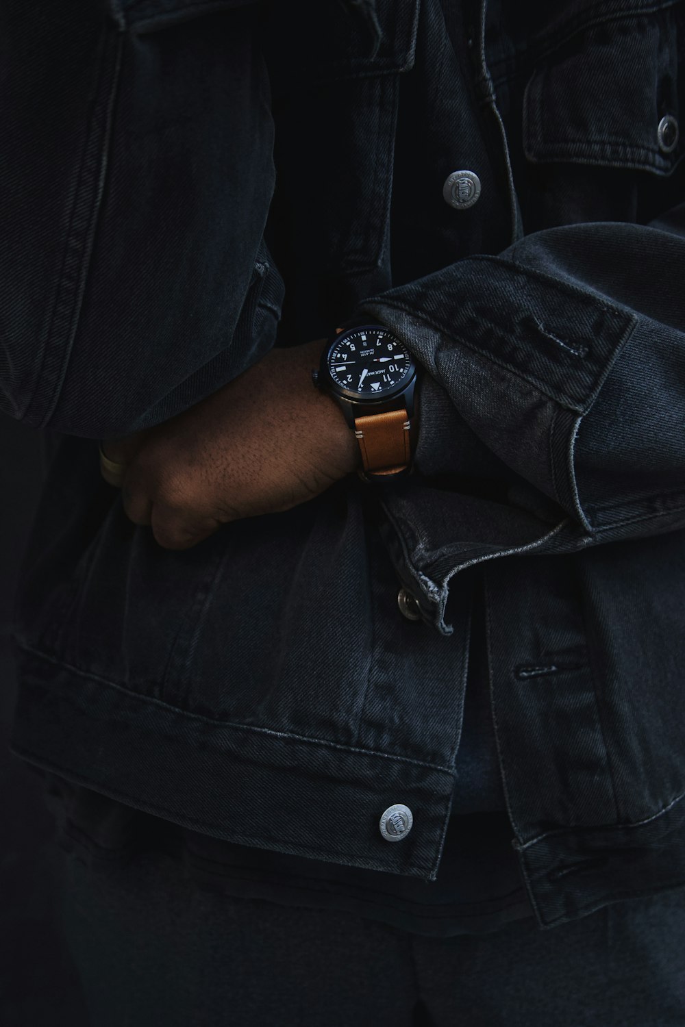 person wearing analog watch