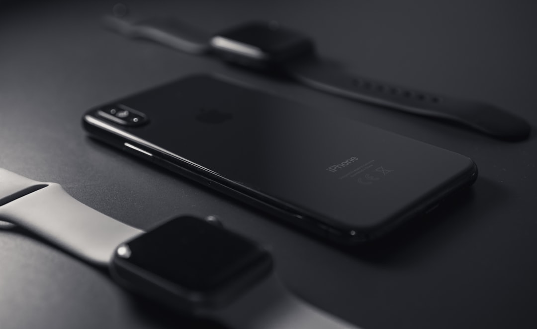 space grey iPhone X on black surface
