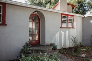 Front view of the first residence with a cozy entrance and natural light