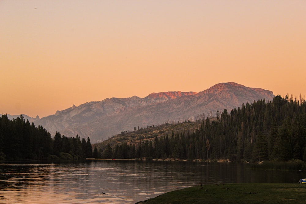 body of water under orange sky