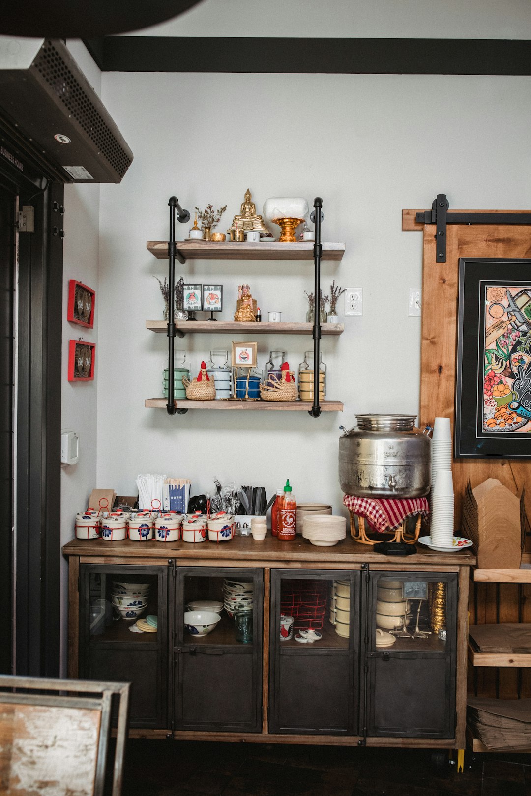 wall-mount rack over sideboard with jars on top