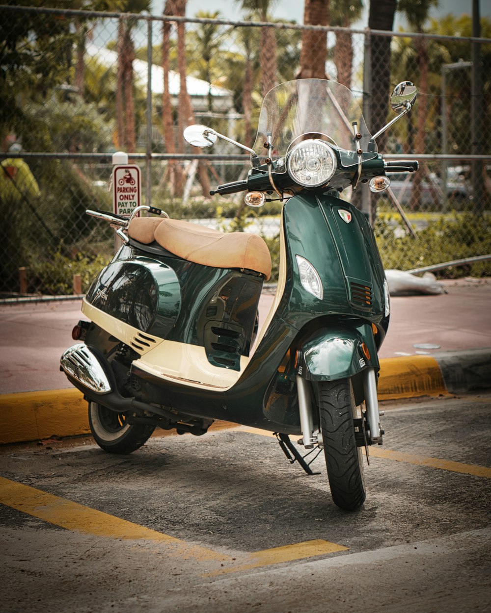 green and beige motor scooter
