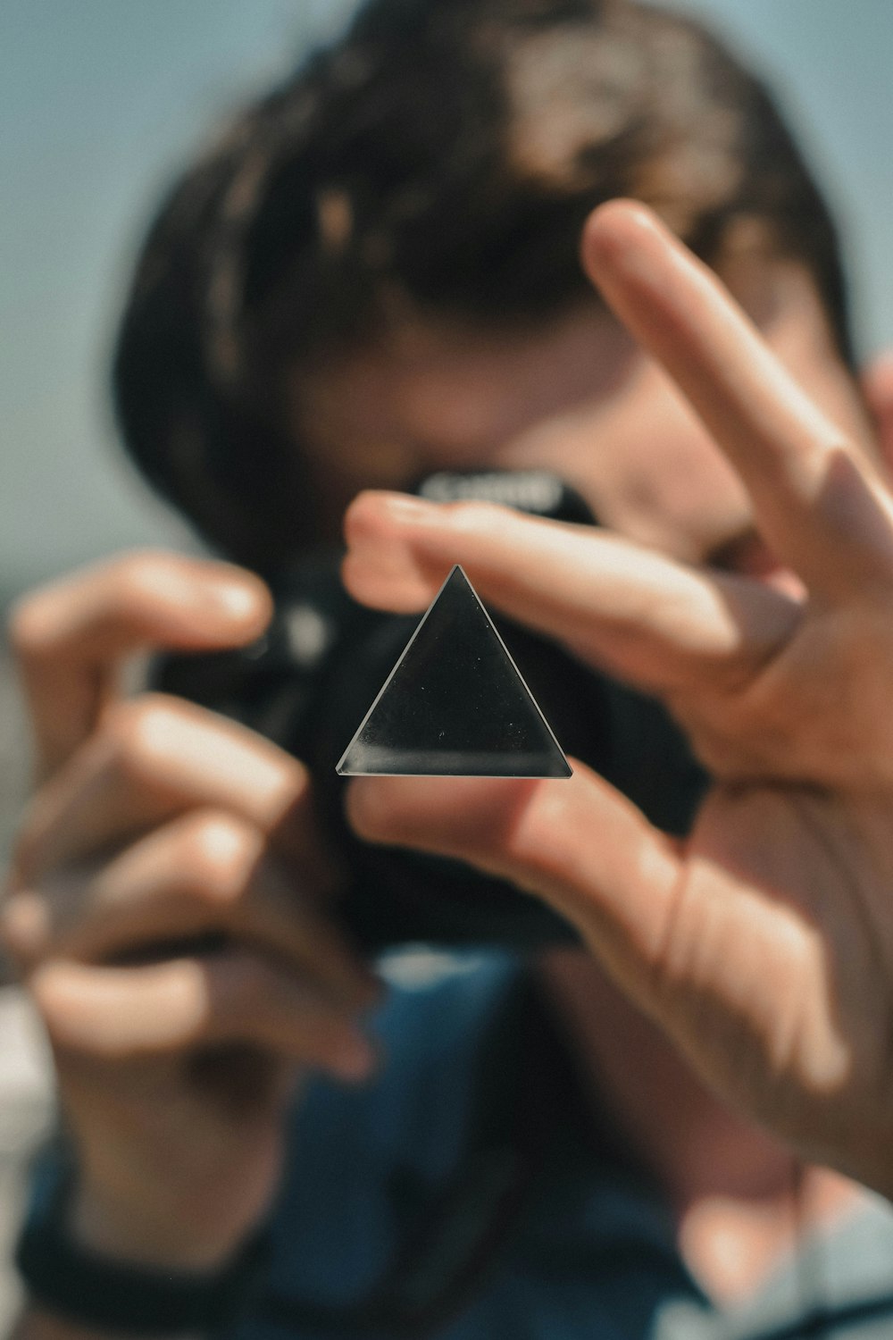 a person taking a picture of a triangle
