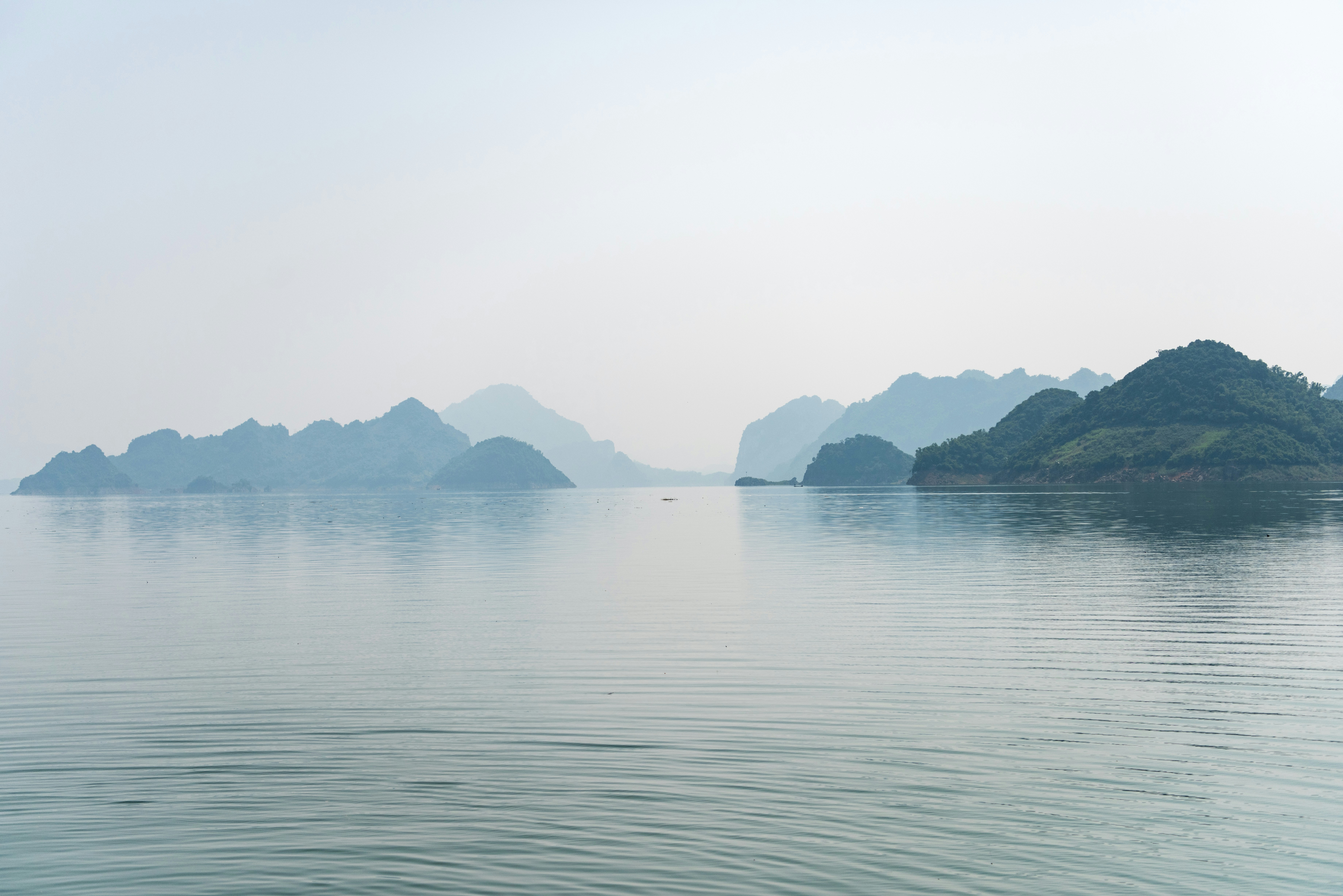 blue sea under white clouds