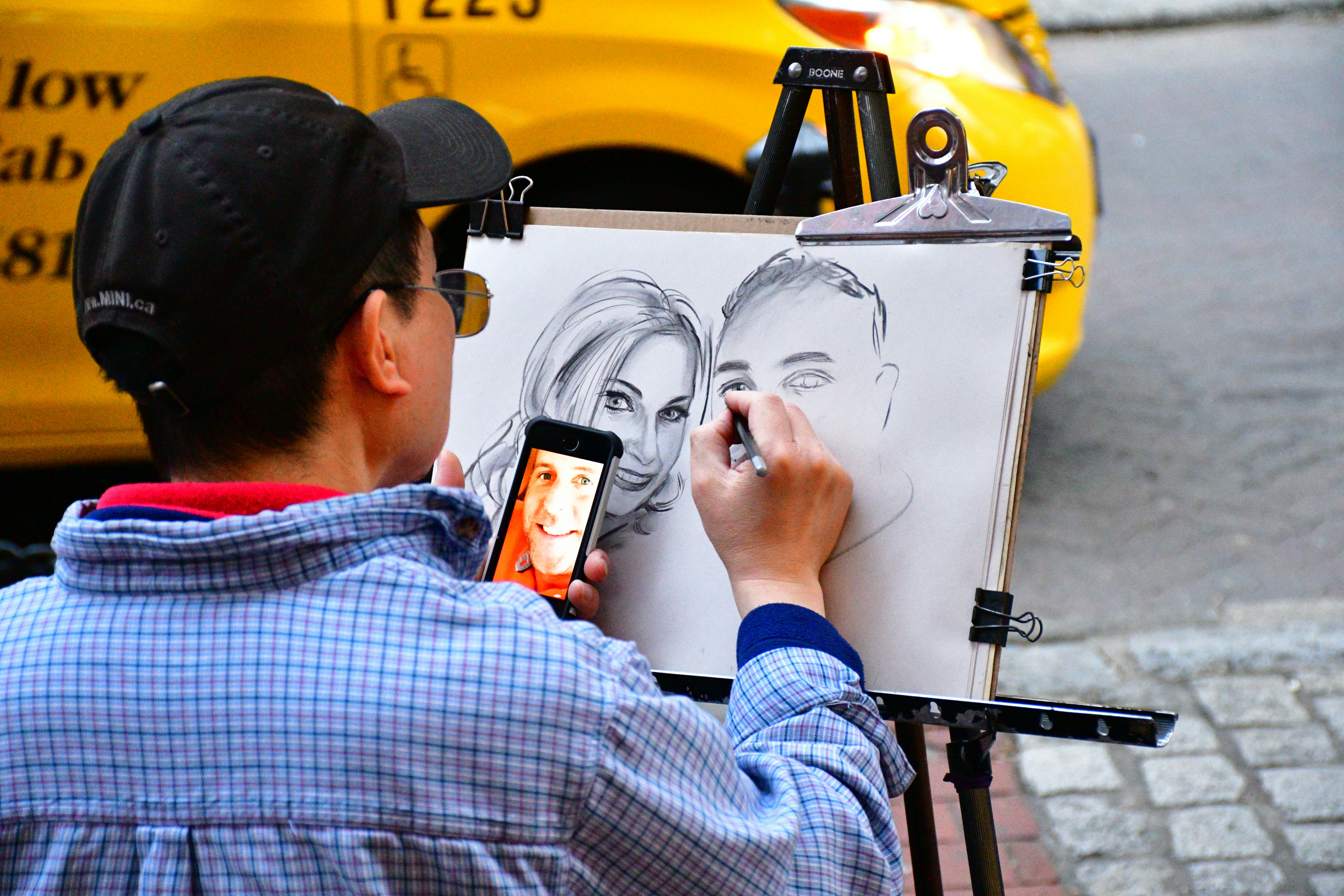 man paints man and woman