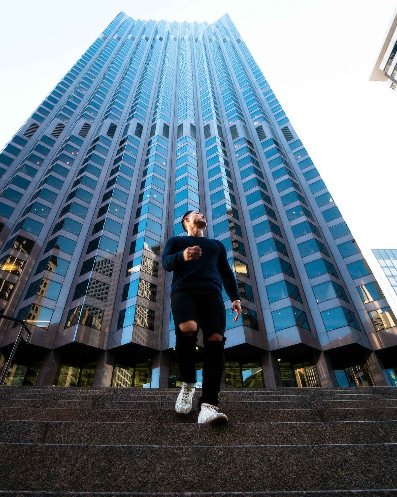 Sony a6300 + Sony E 10-18mm F4 OSS sample photo. Man standing beside building photography