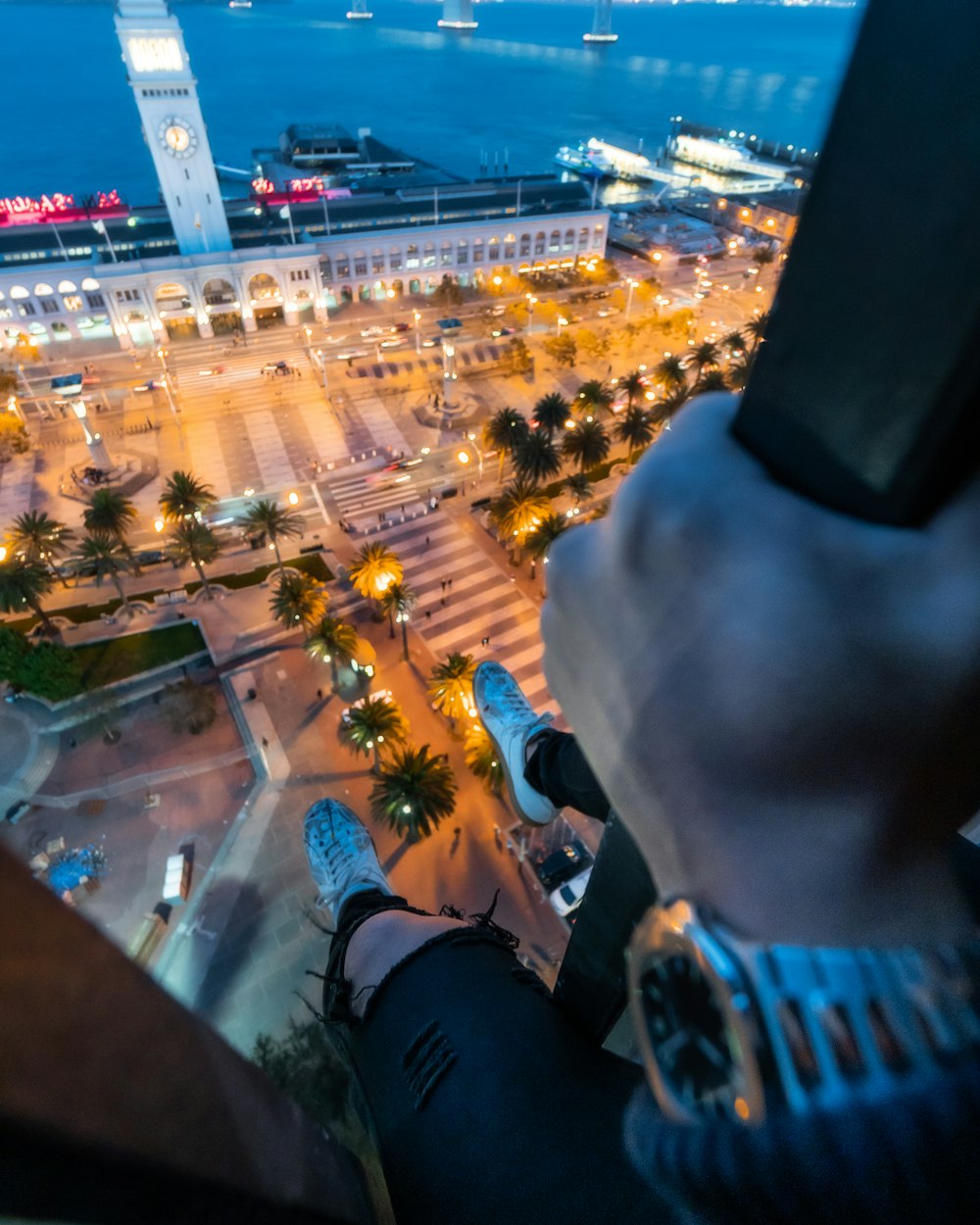 wide-angle photography of building beside body of water during nighttime