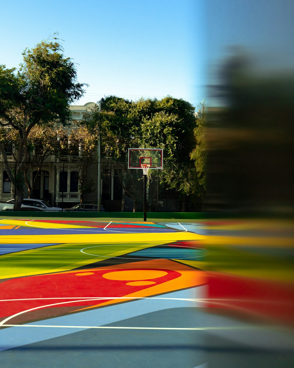 red, purple, and yellow basketball court