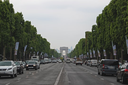 rows of vehicle on road in Champs-Élysées France