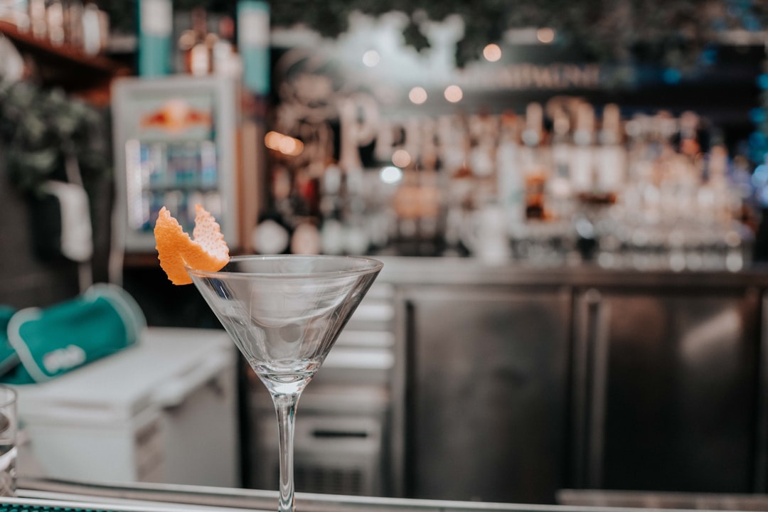 shallow focus photography of clear martini glass