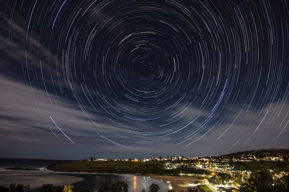 a star trail over a city at night