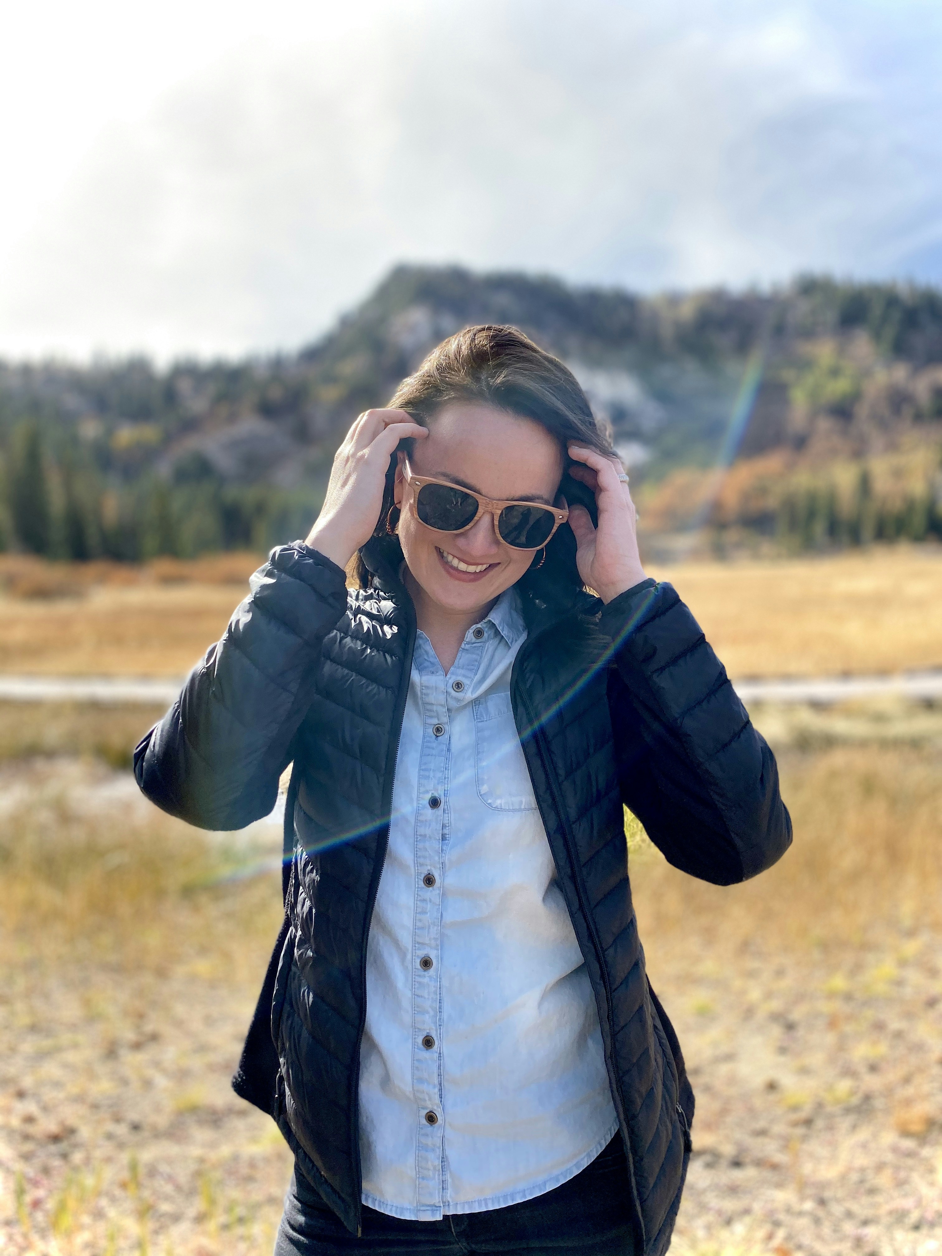 woman wears black zip-up jacket