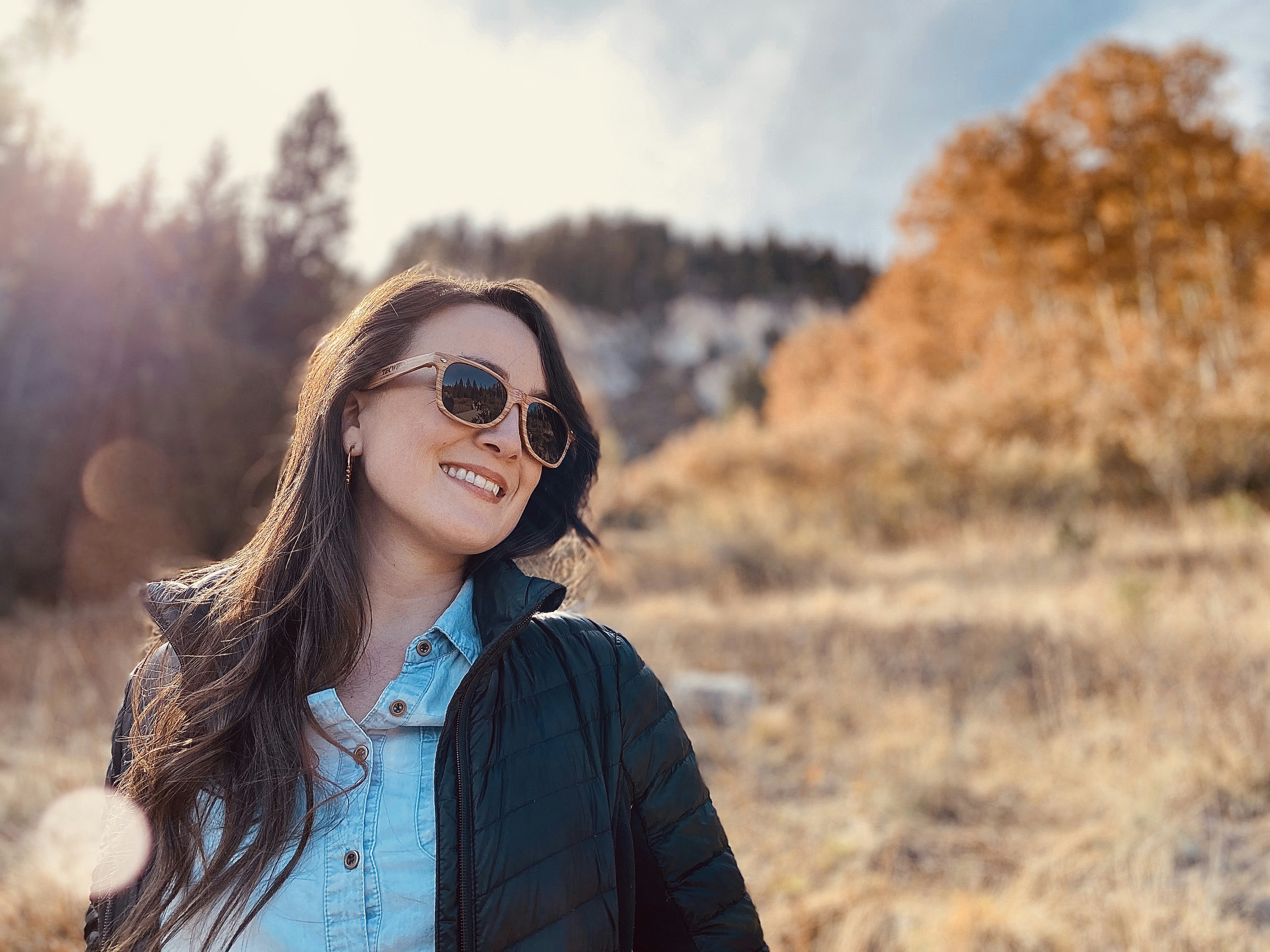 Smiling girl with sunglasses in the fall. (Silver Lake, Big Cottonwood Canyon, Utah)