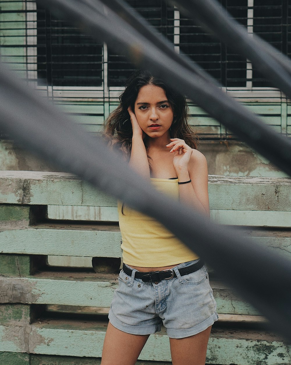 women's yellow crop top and blue denim short shorts